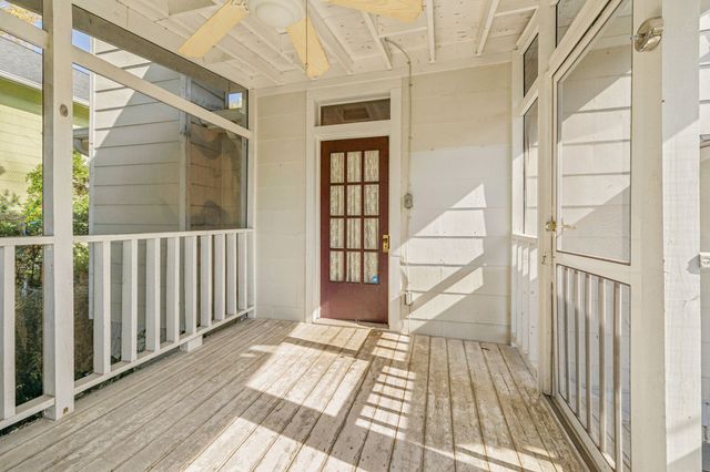 a view of a balcony with wooden floor