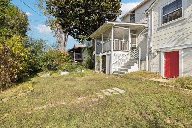 a house with trees in front of it