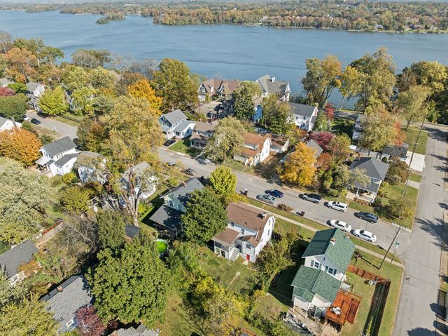 an aerial view of a house with a lake view