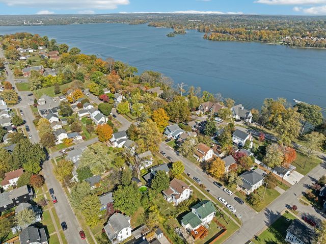 an aerial view of beach and residential houses with outdoor space