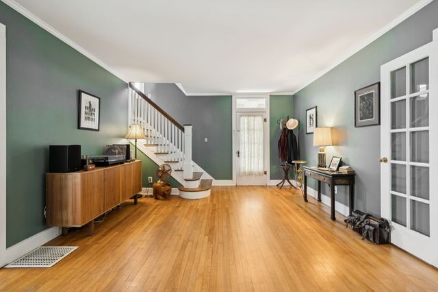 a room with furniture and wooden floor