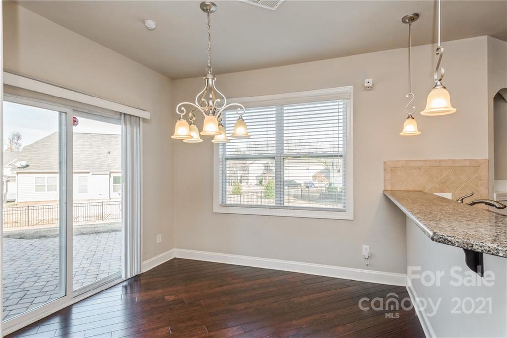 108 Kentmere Lane Clover, SC 29710 - Photo 12 of 36 a view of a room with wooden floor chandelier and windows