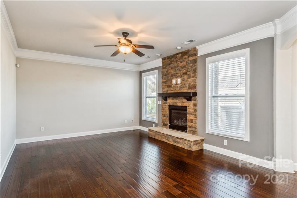 108 Kentmere Lane Clover, SC 29710 - Photo 13 of 36 a view of an empty room with wooden floor fireplace and a window