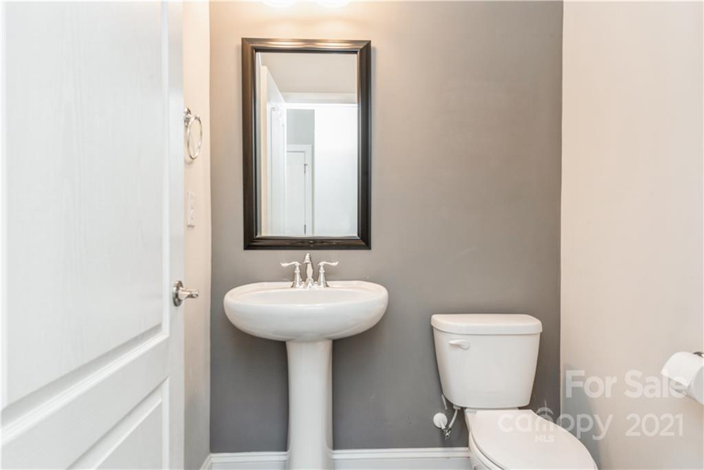 108 Kentmere Lane Clover, SC 29710 - Photo 16 of 36 a bathroom with a toilet sink and mirror