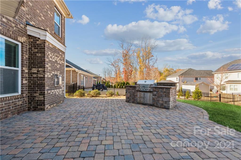 108 Kentmere Lane Clover, SC 29710 - Photo 18 of 36 a view of a chairs and fire pit in the patio in front of building