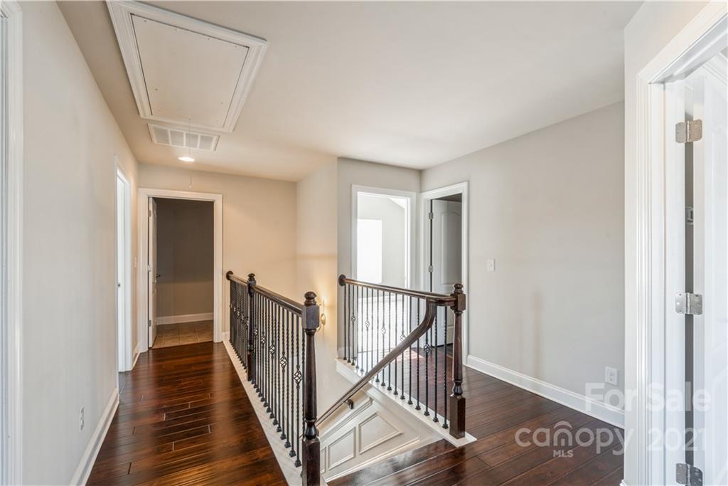 108 Kentmere Lane Clover, SC 29710 - Photo 21 of 36 a view of a hallway with wooden floor and staircase