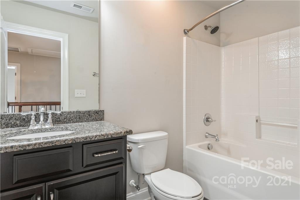 108 Kentmere Lane Clover, SC 29710 - Photo 30 of 36 a bathroom with a granite countertop toilet sink and mirror
