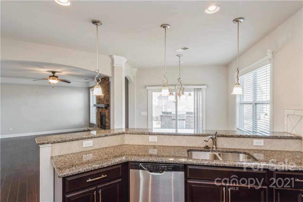 108 Kentmere Lane Clover, SC 29710 - Photo 10 of 36 a kitchen with granite countertop a sink a counter space appliances and cabinets