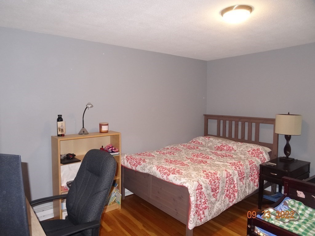 41 Hazen Road Shirley, MA 01464 - Photo 18 of 40 a bedroom with a bed chair and a window
