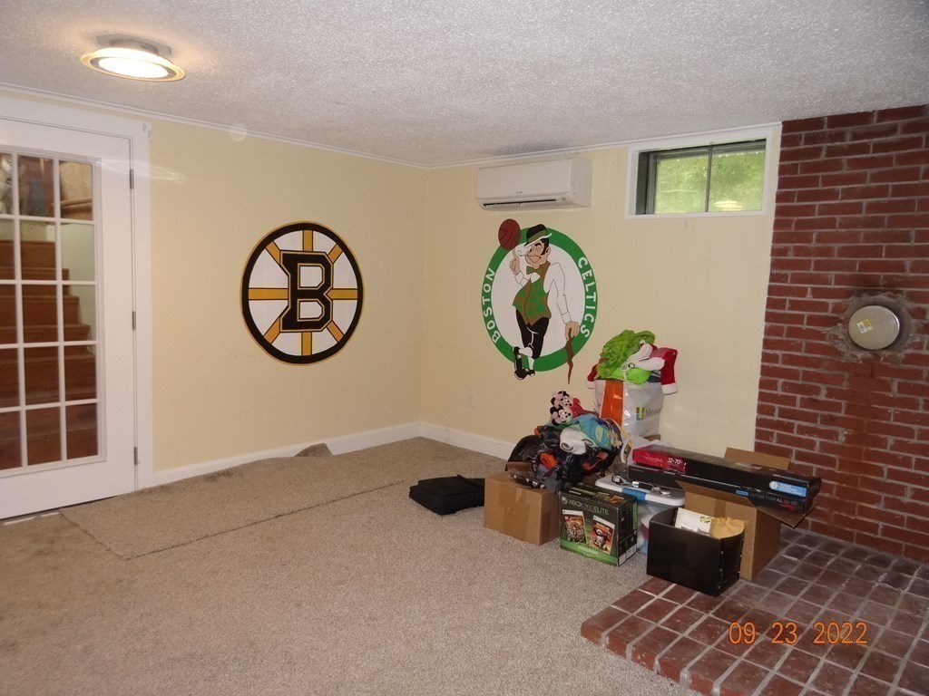 41 Hazen Road Shirley, MA 01464 - Photo 23 of 40 a room with toys and paintings on the wall