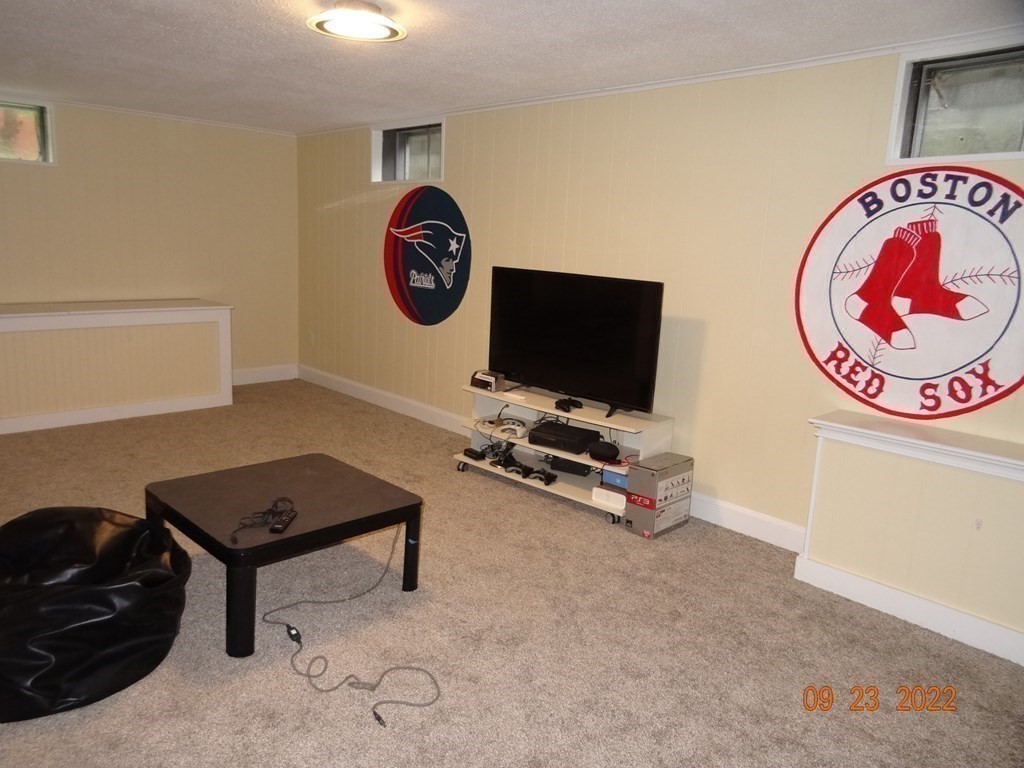 41 Hazen Road Shirley, MA 01464 - Photo 25 of 40 a room with furniture and a flat screen tv