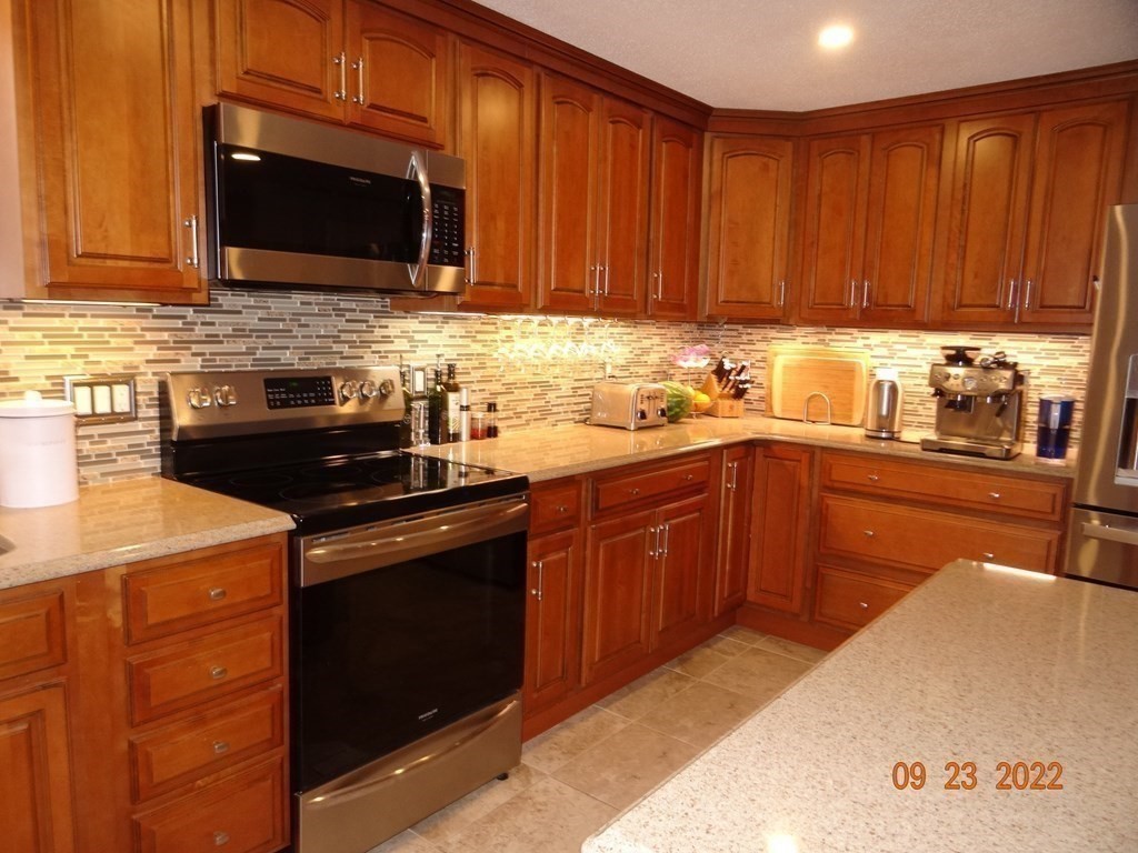 41 Hazen Road Shirley, MA 01464 - Photo 7 of 40 a kitchen with a sink stove and microwave