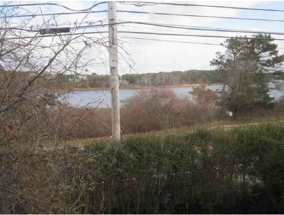 889 Orleans Road North Chatham, MA 02650 - Photo 3 of 10 a view of lake with a yard