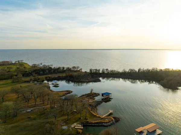 a view of a lake with houses with outdoor space