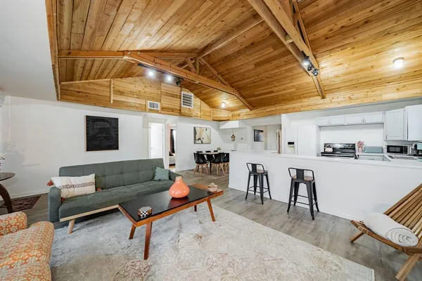 a living room with furniture and a table