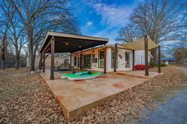 a backyard view of a house with fire pit