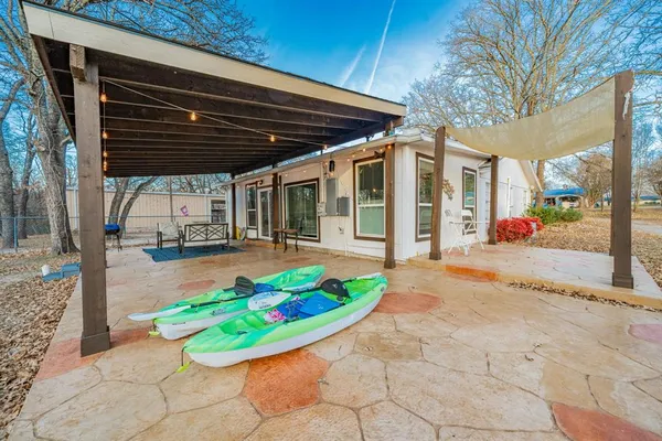 a view of outdoor space with table and chairs