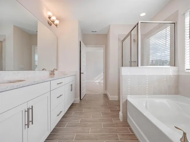 a bathroom with a sink and vanity
