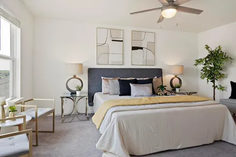 a bedroom with a bed and window