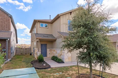 a front view of a house with a garage