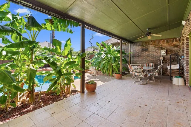 a bench is sitting in middle of the patio