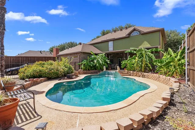 a view of a swimming pool with a patio