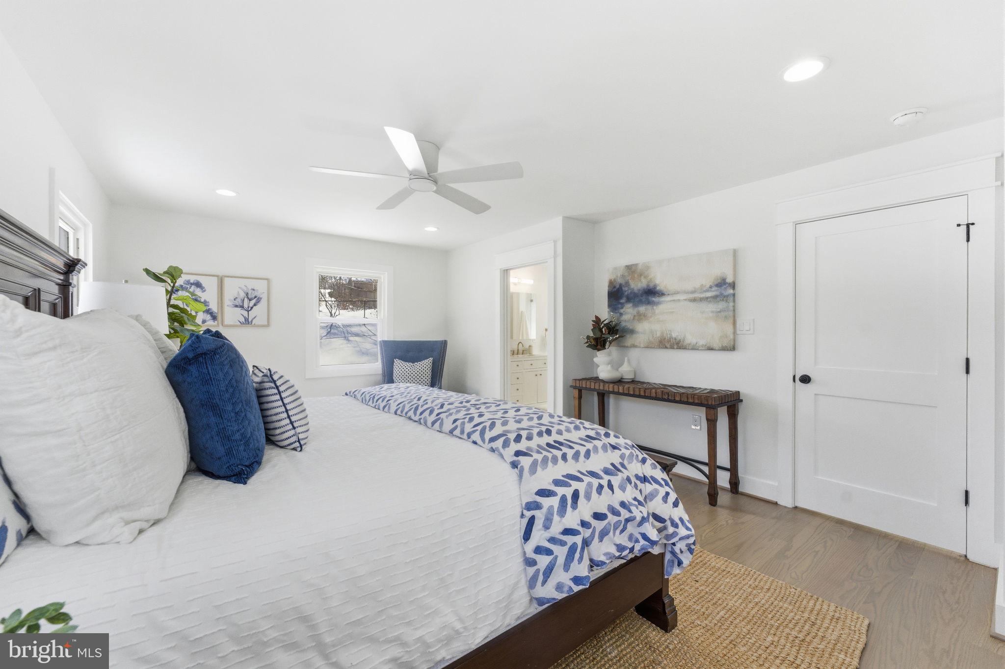 8615 Kerry Lane Springfield, VA 22152 - Photo 12 of 50 a bedroom with a large bed and a chandelier