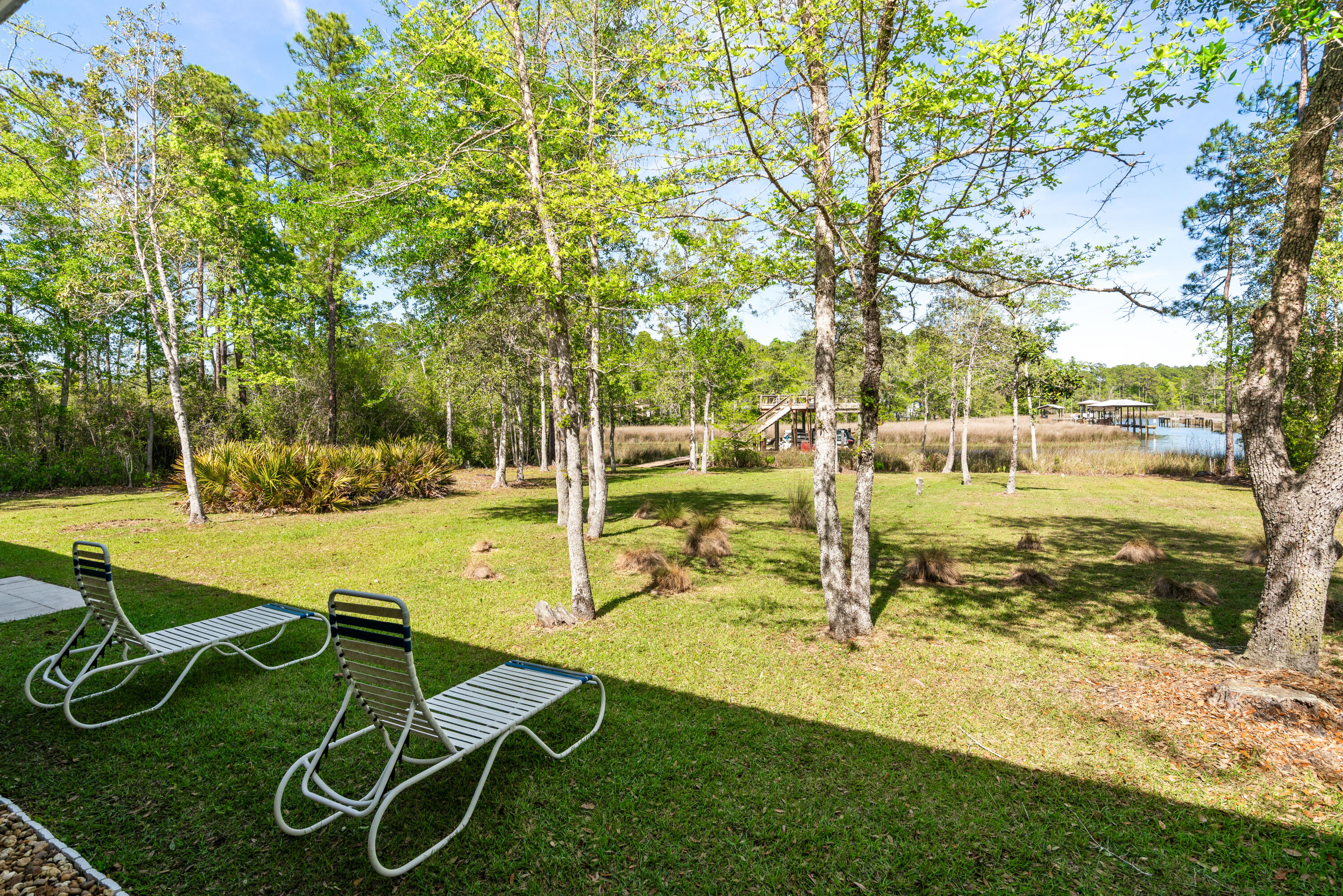 528 Bay Grove Road Freeport, FL 32439 - Photo 35 of 68 a view of a swimming pool with a garden