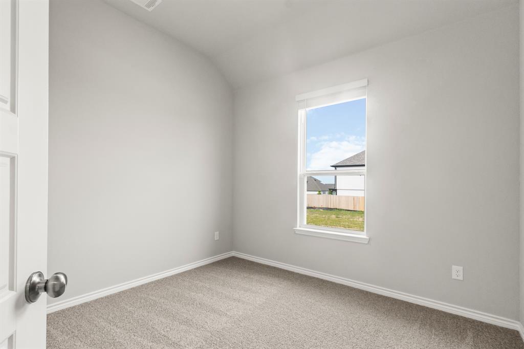 6909 Cattle Car Way Crowley, TX 76036 - Photo 12 of 24 an empty room with a window