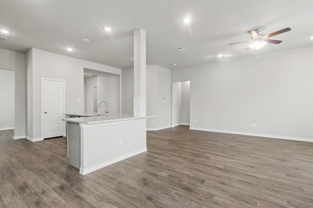 6909 Cattle Car Way Crowley, TX 76036 - Photo 6 of 24 a large room with a lot of white cabinets