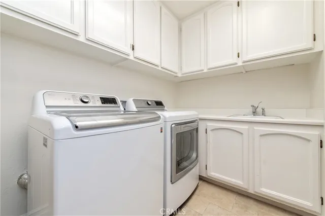a bathroom with a granite countertop sink toilet and a bathtub