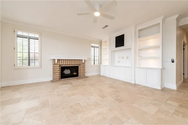 a living room with a fireplace and a window