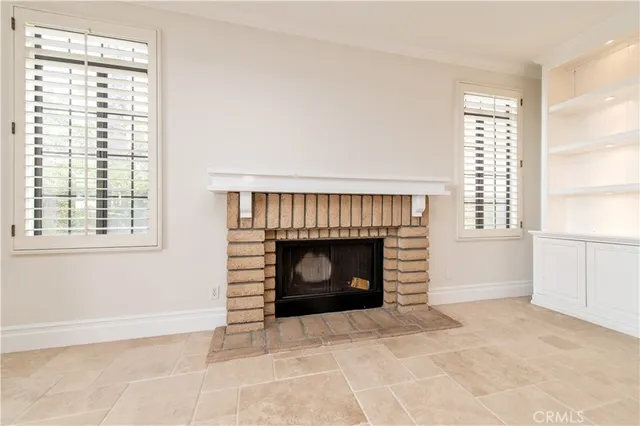 a view of an empty room with a kitchen