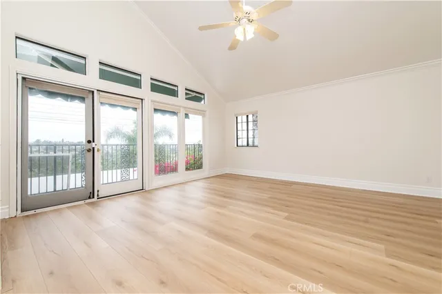 a living room with a fireplace with wooden floor