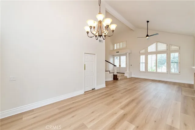 a view of a kitchen with kitchen island a sink a counter top space and cabinets