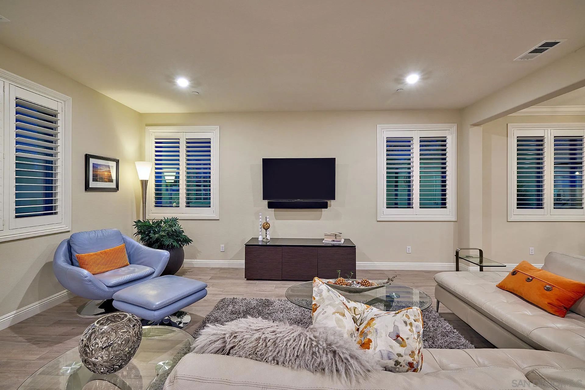 1179 Tesoro Place Vista, CA 92081 - Photo 11 of 49 a living room with furniture and a flat screen tv