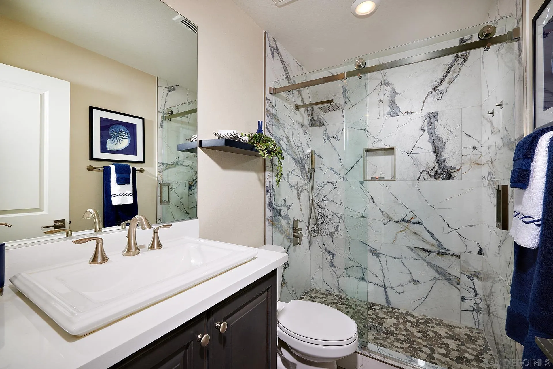 1179 Tesoro Place Vista, CA 92081 - Photo 15 of 49 a bathroom with a sink toilet and shower