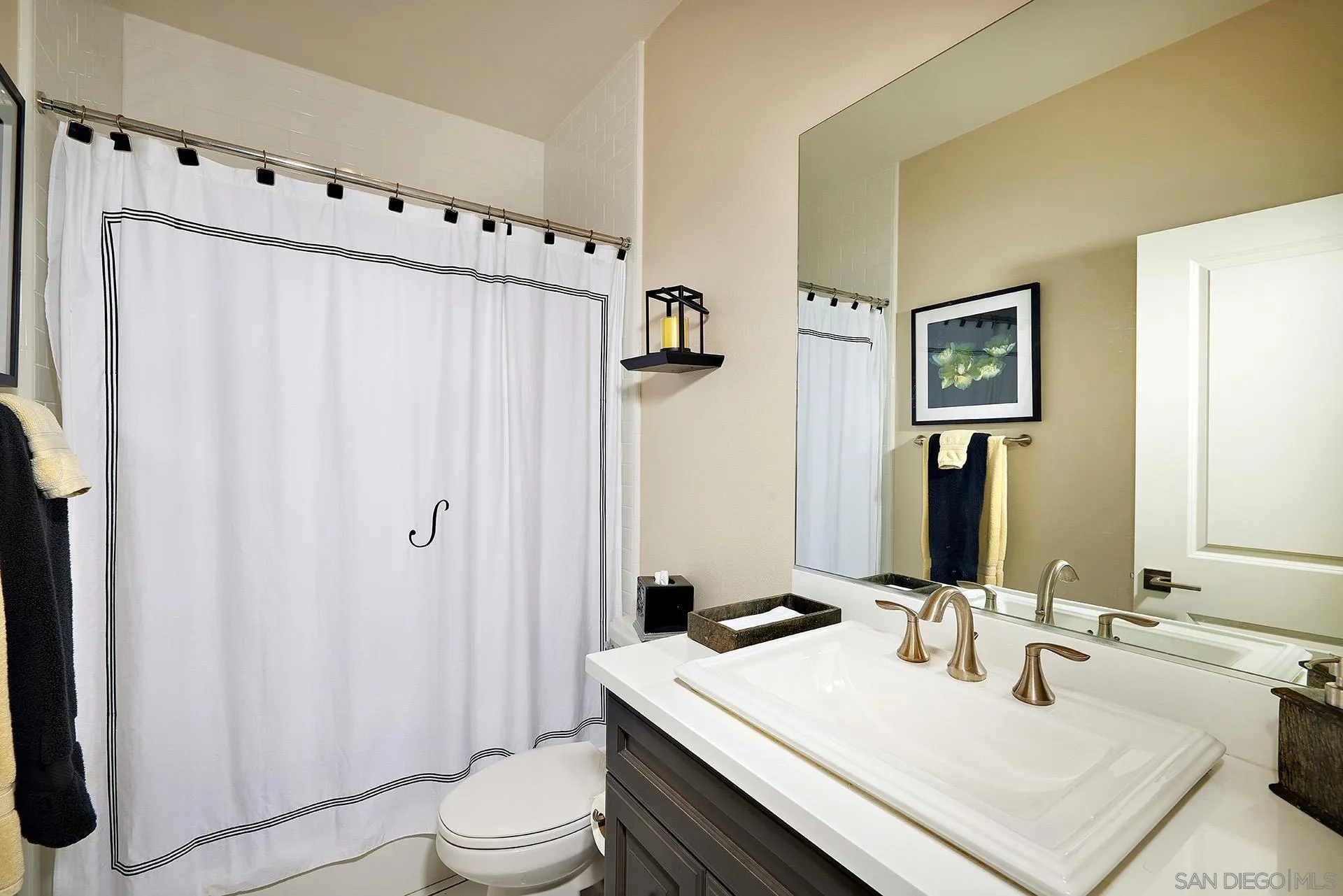 1179 Tesoro Place Vista, CA 92081 - Photo 22 of 49 a bathroom with a sink a toilet and shower