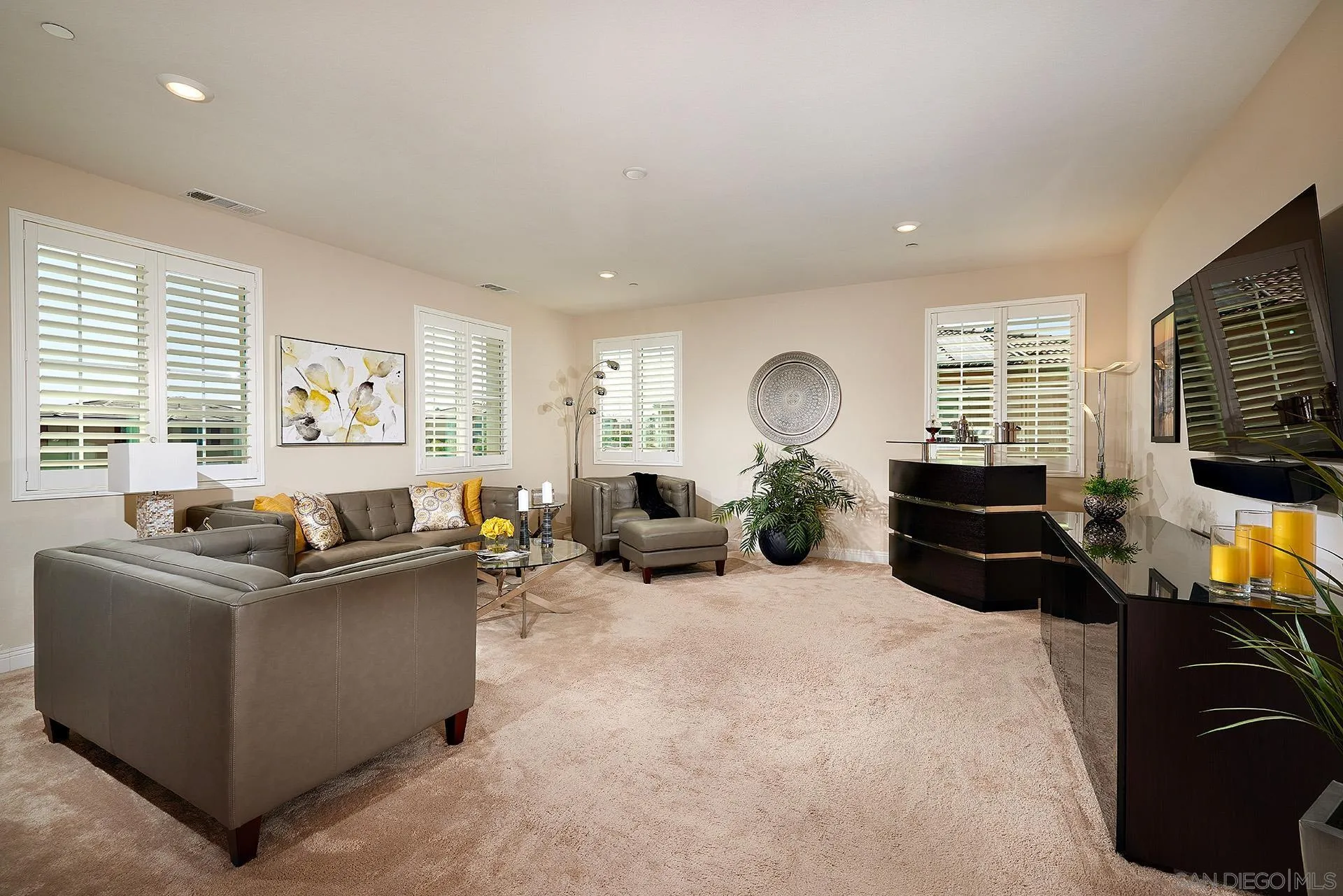1179 Tesoro Place Vista, CA 92081 - Photo 23 of 49 a living room with furniture and a flat screen tv