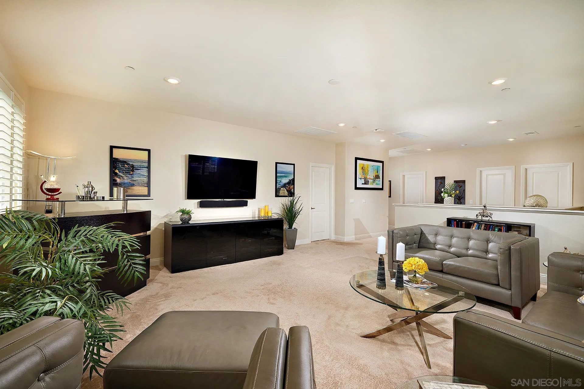 1179 Tesoro Place Vista, CA 92081 - Photo 24 of 49 a living room with furniture and a flat screen tv