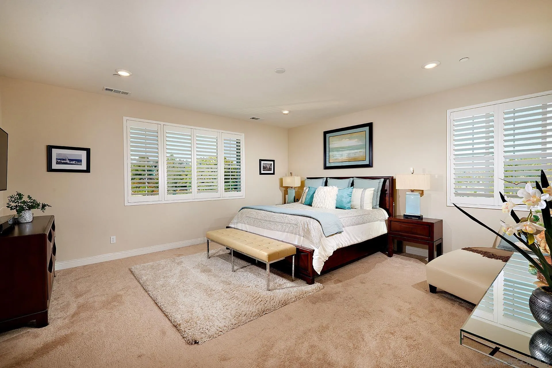 1179 Tesoro Place Vista, CA 92081 - Photo 26 of 49 a bedroom with a bed and wooden floor