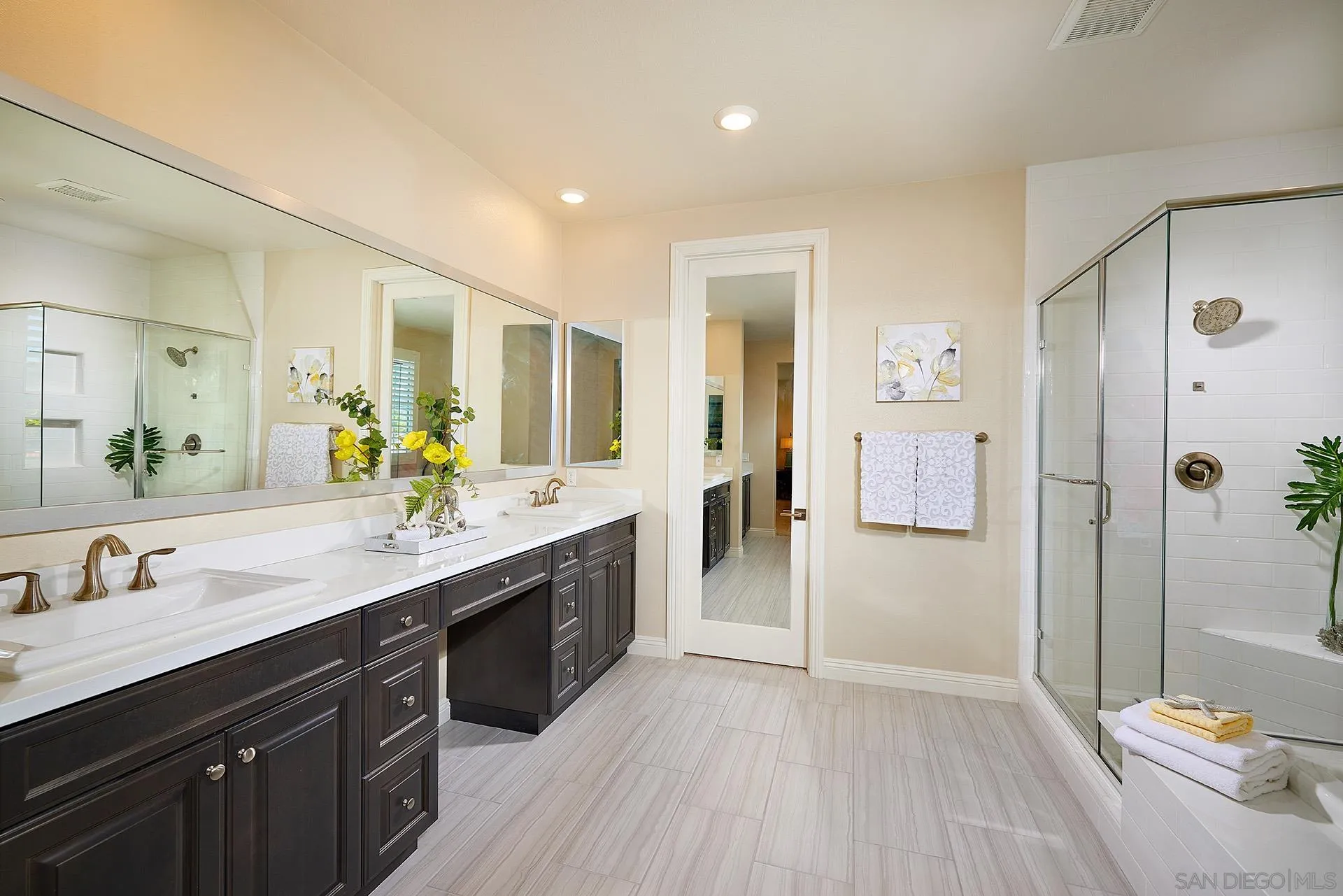 1179 Tesoro Place Vista, CA 92081 - Photo 28 of 49 a spacious bathroom with a granite countertop sink mirror and shower