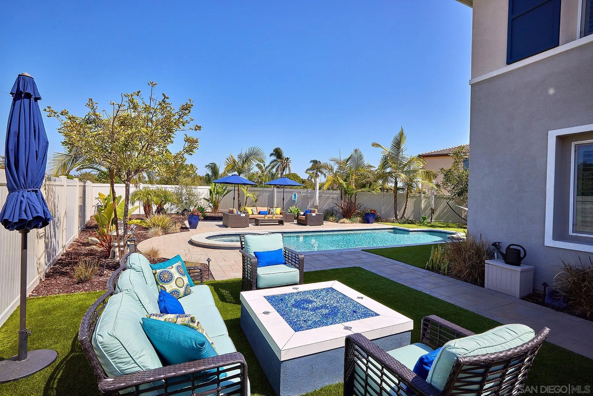 1179 Tesoro Place Vista, CA 92081 - Photo 40 of 49 a view of a dining room with furniture one side and wooden floor