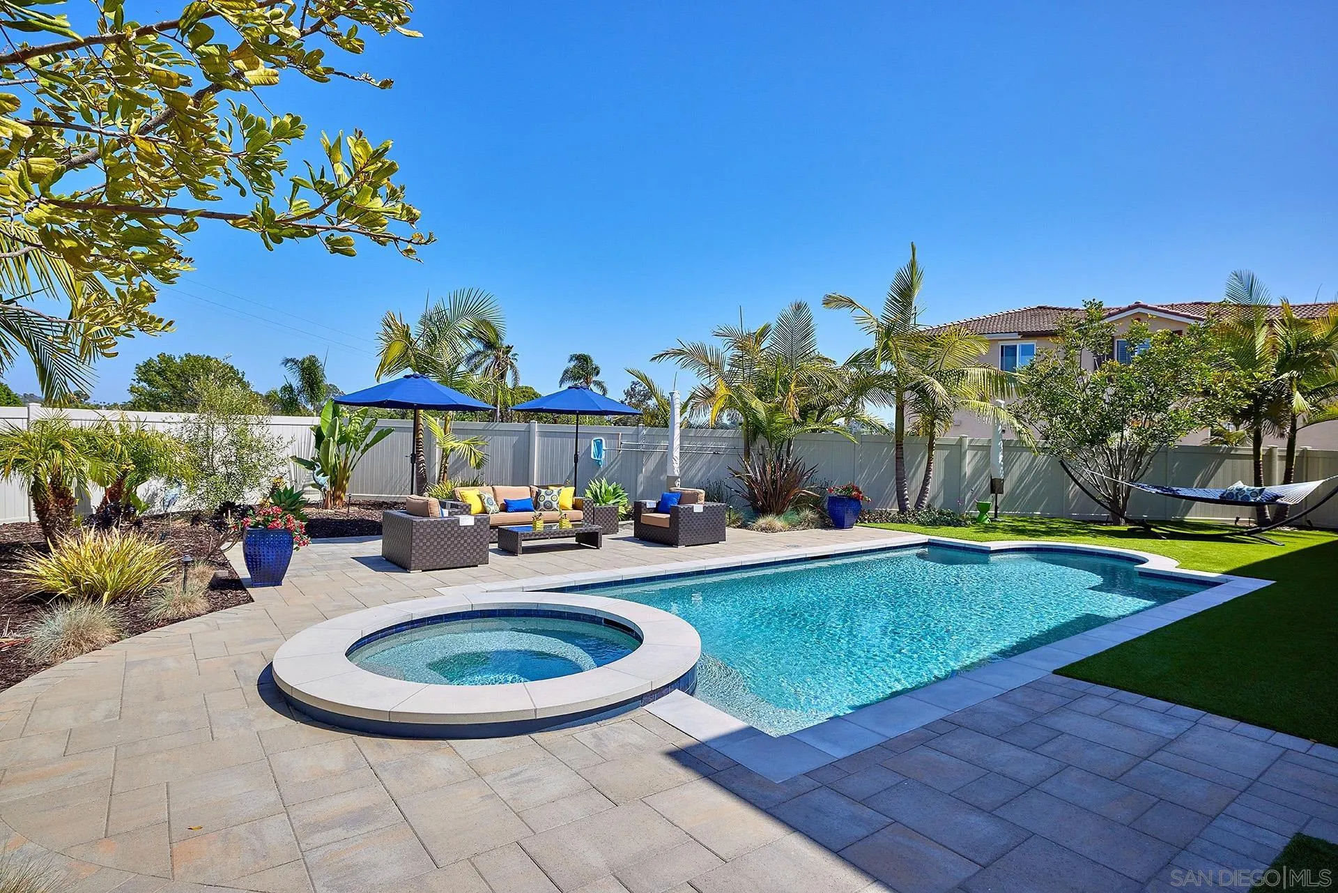 1179 Tesoro Place Vista, CA 92081 - Photo 42 of 49 a view of a swimming pool with an outdoor seating