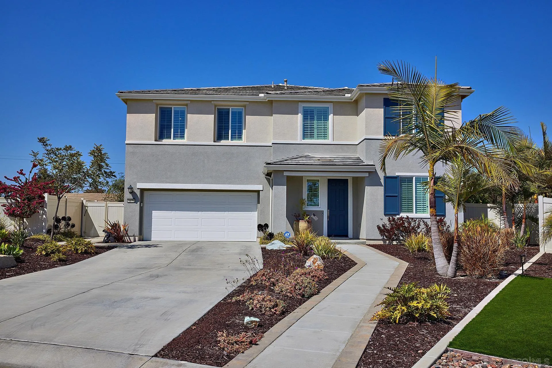 1179 Tesoro Place Vista, CA 92081 - Photo 46 of 49 a front view of a house with garden