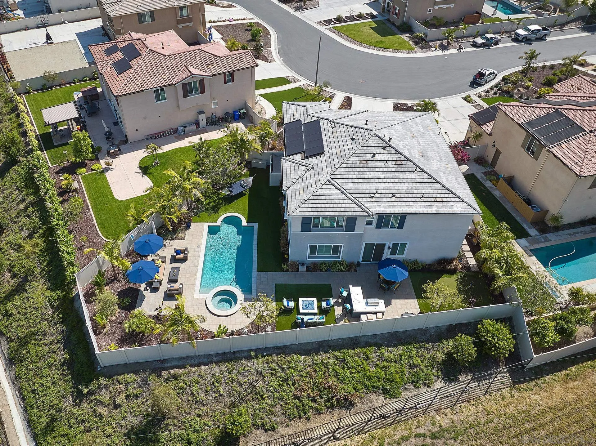 1179 Tesoro Place Vista, CA 92081 - Photo 49 of 49 an aerial view of a house with a yard and a large tree