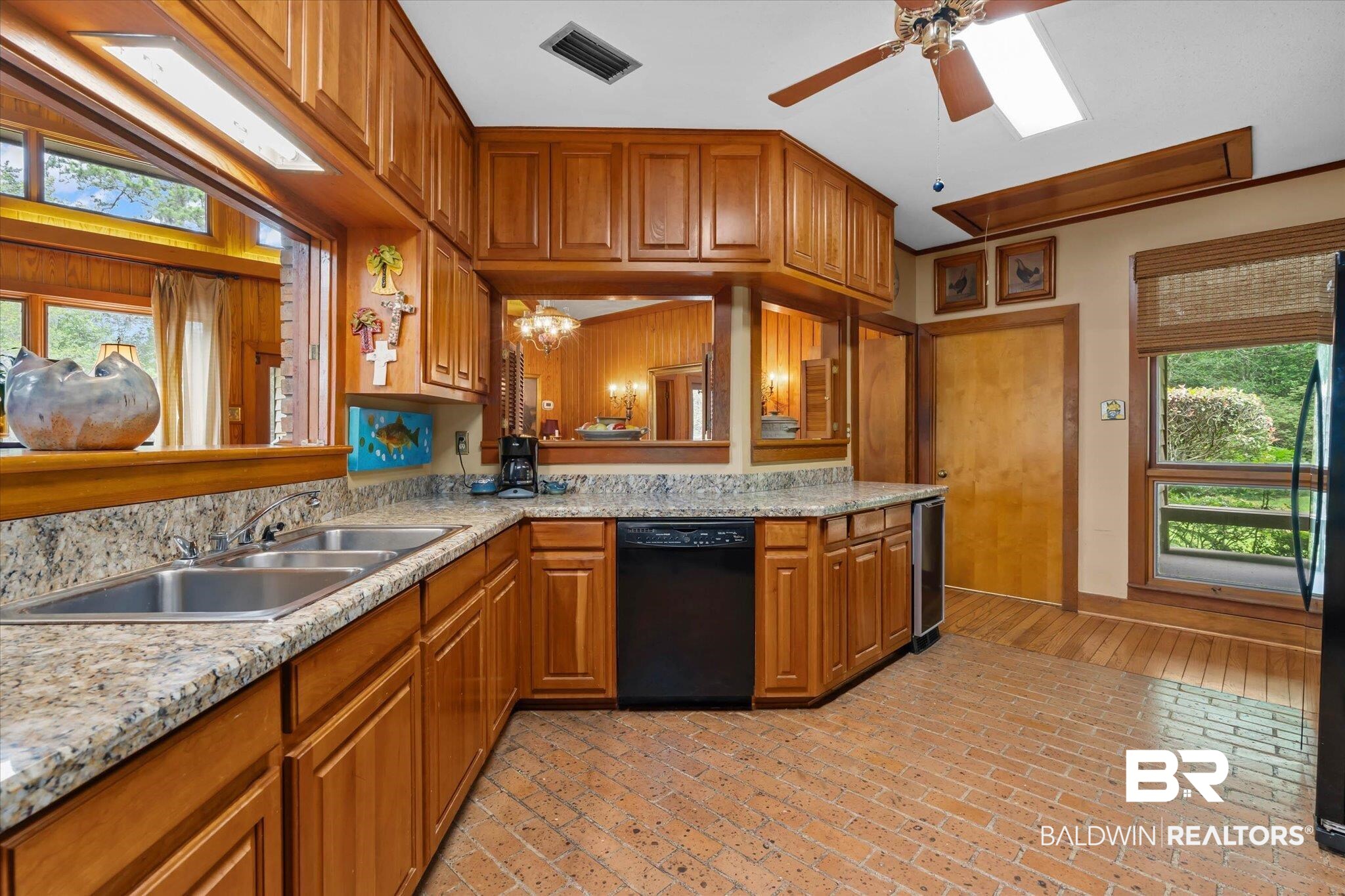 3500 Venetia Road Mobile, AL 36605 - Photo 9 of 56 Kitchen featuring wood cabinetry, granite-finish countertops, and a double basin stainless steel sink