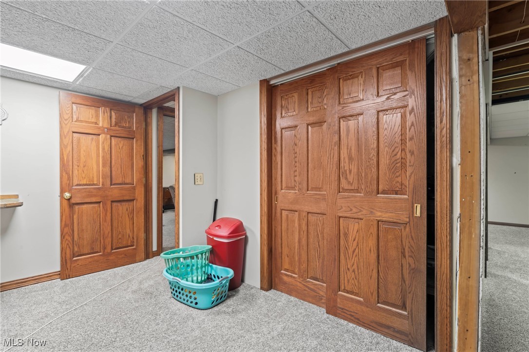 3804 Ridge Road Cortland, OH 44410 - Photo 42 of 44 Laundry featuring carpet flooring and a paneled ceiling