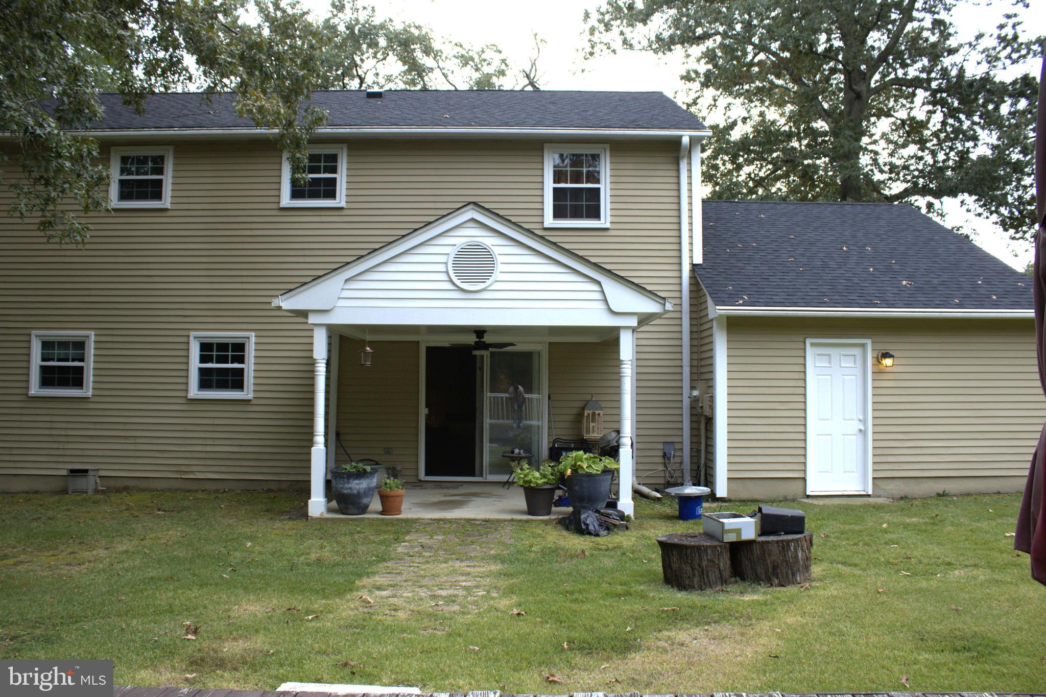 3910 Oaklawn Road Fort Washington, MD 20744 - Photo 2 of 17 a view of a house with a yard chairs and table in a patio
