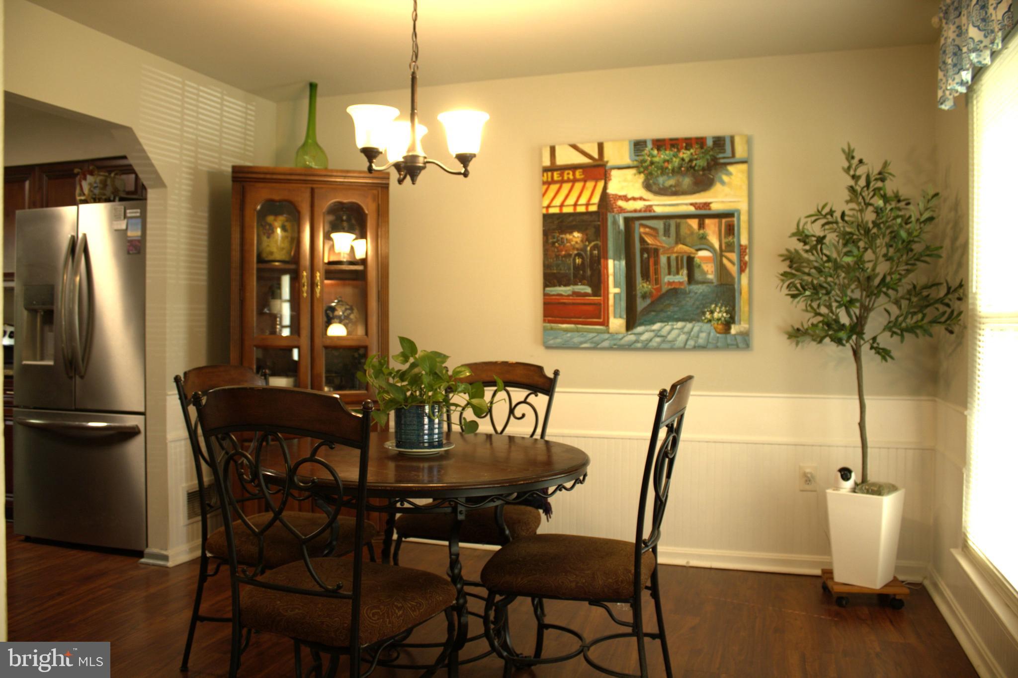 3910 Oaklawn Road Fort Washington, MD 20744 - Photo 5 of 17 a view of a dining room with furniture and a chandelier